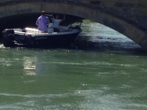 boat under bridge in Arundel