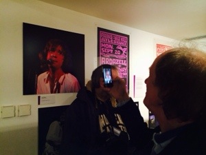 John Otway takes a picture of the John Otway exhibit