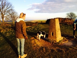 That Nice Lady Decorator at the Cissbury Ring with her black and white horror hound walking in sussex